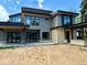 Modern exterior featuring gray siding, sleek black trim, wood accents, and multiple windows at 2442 S Saint Paul St, Denver, CO 80210