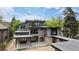 Striking modern two-story home with spacious rooftop terrace, sleek lines, and inviting outdoor living spaces at 2442 S Saint Paul St, Denver, CO 80210