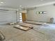 Spacious, unfinished two-car garage with white walls, potential for customization, and ample natural light at 2442 S Saint Paul St, Denver, CO 80210