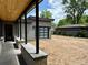 Detached garage with wood ceiling and black support beams, offering both style and functionality at 2442 S Saint Paul St, Denver, CO 80210