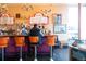 Bright coffee shop interior with counter seating, retro decor and a full menu at 2442 S Saint Paul St, Denver, CO 80210