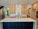 Bright kitchen featuring a central island, pendant lights, and custom cabinetry at 2442 S Saint Paul St, Denver, CO 80210