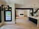 Bonus room featuring light-colored cabinets, quartz countertop, and stainless steel sink at 2442 S Saint Paul St, Denver, CO 80210