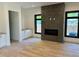 Spacious living room featuring a tile fireplace, built-in cabinetry, and lots of natural light at 2442 S Saint Paul St, Denver, CO 80210