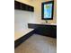 Modern mud room with custom cabinets, bench, and tile flooring at 2442 S Saint Paul St, Denver, CO 80210