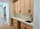 Mud room featuring light-colored cabinets, quartz countertop, and stainless steel sink at 2442 S Saint Paul St, Denver, CO 80210