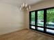 Inviting, naturally lit room with hardwood floors, black-framed windows, and contemporary light fixture at 2442 S Saint Paul St, Denver, CO 80210