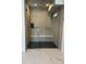Contemporary shower with glass door, rain shower head, and tiled walls at 2442 S Saint Paul St, Denver, CO 80210
