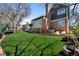Lush backyard featuring manicured lawn and a cozy patio for outdoor enjoyment at 5795 S Pagosa Way, Centennial, CO 80015