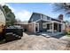 Spacious backyard showcasing a hot tub, covered patio, and stylish landscaping for ultimate outdoor relaxation at 5795 S Pagosa Way, Centennial, CO 80015