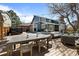 Well-appointed backyard with a hot tub, patio seating, and a dining area, perfect for entertaining at 5795 S Pagosa Way, Centennial, CO 80015