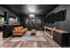 This finished basement features modern lighting, a stylish bar, hardwood floors and comfortable seating at 5795 S Pagosa Way, Centennial, CO 80015