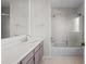 Neutral bathroom with a single sink vanity and shower-tub combination at 5795 S Pagosa Way, Centennial, CO 80015