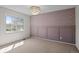 Cozy bedroom with accent wall and modern light fixture at 5795 S Pagosa Way, Centennial, CO 80015