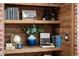 Close-up of wooden bookshelf, filled with books and decorative items at 5795 S Pagosa Way, Centennial, CO 80015