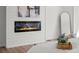 Close-up of a modern fireplace with wood detail in the main bedroom at 5795 S Pagosa Way, Centennial, CO 80015