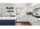 Bright, modern kitchen with white cabinetry, and quartz countertops at 5795 S Pagosa Way, Centennial, CO 80015