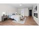 Spacious main bedroom with wood-look floors, fireplace, and ensuite bathroom at 5795 S Pagosa Way, Centennial, CO 80015