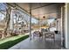 Inviting covered patio features stylish seating, overhead lighting, and an outdoor fireplace, perfect for relaxing at 5795 S Pagosa Way, Centennial, CO 80015