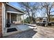 Charming backyard featuring a covered patio, outdoor furniture, and a cozy fireplace for year-round enjoyment at 5795 S Pagosa Way, Centennial, CO 80015