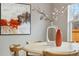 Dining room with chandelier, hardwood floors, modern art and natural light at 3212 Pierce St, Wheat Ridge, CO 80033