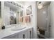 Well-lit bathroom with a single sink vanity, and a shower-tub combination with a curtain at 1050 S Monaco Pkwy # 35, Denver, CO 80224