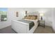 Bright bedroom with a plush bed, neutral colors, and ample natural light from the window at 1050 S Monaco Pkwy # 35, Denver, CO 80224