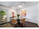 Dining area featuring a glass top table, unique lighting, and access to the outdoors at 1050 S Monaco Pkwy # 35, Denver, CO 80224