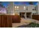 Exterior of a well-maintained townhouse with private front patio and landscaped garden at 1050 S Monaco Pkwy # 35, Denver, CO 80224