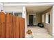 Inviting front porch with a decorative door, potted plants, and a cozy entrance at 1050 S Monaco Pkwy # 35, Denver, CO 80224