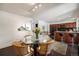 Open concept kitchen and dining area with bar seating, modern appliances, and ample space at 1050 S Monaco Pkwy # 35, Denver, CO 80224