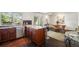 Modern kitchen with stainless steel appliances, wood cabinets, and a view to the dining area at 1050 S Monaco Pkwy # 35, Denver, CO 80224