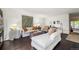 Bright and airy living room with hardwood floors, stylish decor, and ample natural light at 1050 S Monaco Pkwy # 35, Denver, CO 80224