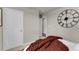 Comfortable bedroom featuring a cozy chunky knit blanket and elegant, oversized Roman numeral clock at 46550 Avery Ln, Bennett, CO 80102