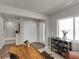 Stylish entryway with hardwood floors, a modern console table, and convenient access to the staircase at 46550 Avery Ln, Bennett, CO 80102