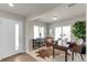 Inviting home office featuring a modern desk, decorative rug, and light-filled windows at 46550 Avery Ln, Bennett, CO 80102