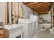 Unfinished basement laundry area with washer, dryer, and utility sink at 7708 S Cove Cir, Centennial, CO 80122