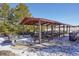 Covered picnic pavilion with tables, benches, and grill at 7708 S Cove Cir, Centennial, CO 80122