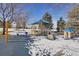 Play area with swings, shade structure, and playhouse at 7708 S Cove Cir, Centennial, CO 80122