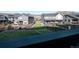 View of a spacious fenced backyard featuring green grass and lovely two-story home at 2967 S Quaker St, Morrison, CO 80465