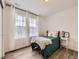 This bedroom is bright and airy with lots of natural light and hardwood floors at 2967 S Quaker St, Morrison, CO 80465