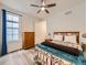 Bright bedroom featuring a window, a ceiling fan, and a wooden dresser, creating a cozy retreat at 2967 S Quaker St, Morrison, CO 80465