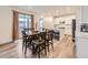 Inviting dining area with a large wooden table, stylish chairs, and natural light at 2967 S Quaker St, Morrison, CO 80465