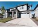 Beautiful two-story home with stone accents, a two-car garage and a well-manicured front lawn at 2967 S Quaker St, Morrison, CO 80465