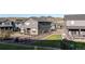 Well-manicured backyard with mountain views and a modern two-story gray home design, and black metal fencing at 2967 S Quaker St, Morrison, CO 80465
