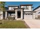 Charming two-story home with stone accents, covered porch, and well-manicured lawn at 2967 S Quaker St, Morrison, CO 80465