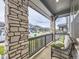 A comfortable porch setting with a bench and stone pillars, offering a relaxing outdoor view at 2967 S Quaker St, Morrison, CO 80465
