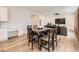 Open concept living area with a dining table, ceiling fan, and TV at 2967 S Quaker St, Morrison, CO 80465