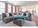 Comfortable living room featuring a large gray sectional couch and lots of pillows at 2967 S Quaker St, Morrison, CO 80465