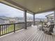 Covered patio with outdoor seating and views of the mountains and surrounding neighborhood at 2967 S Quaker St, Morrison, CO 80465